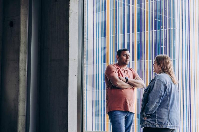 Two students chatting at university